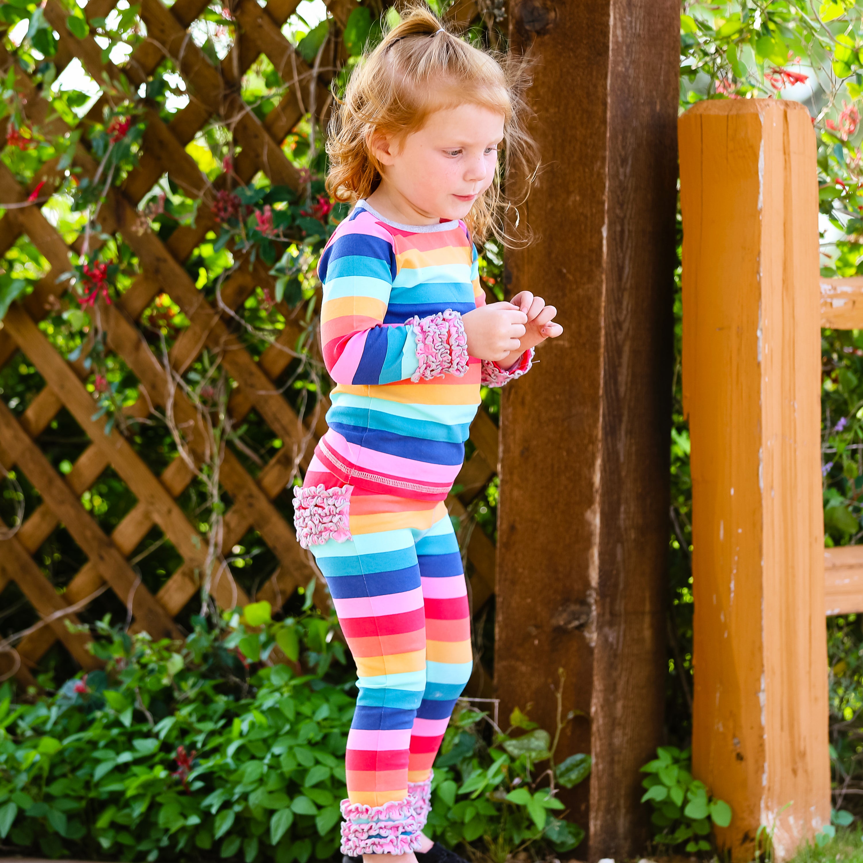 AnnLoren Rainbow Ruffle Butt Leggings for girls, featuring ruffles on the butt and ankles, made from soft Egyptian cotton.